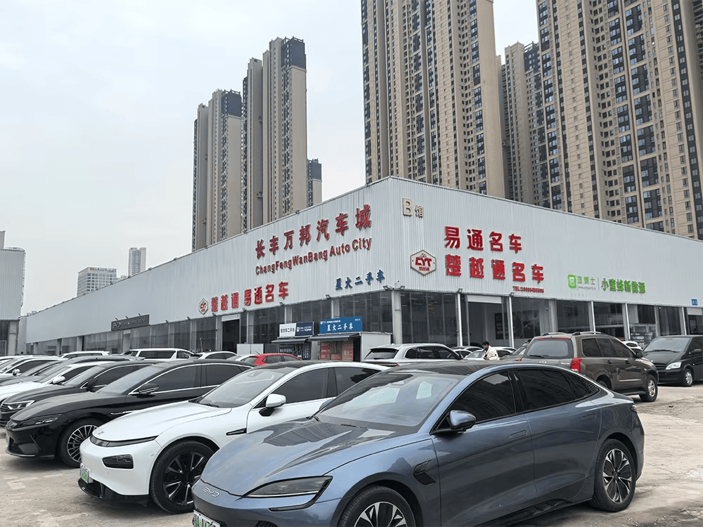 Extensive inventory of new and used cars at the YT Automobile Export dealership in China.